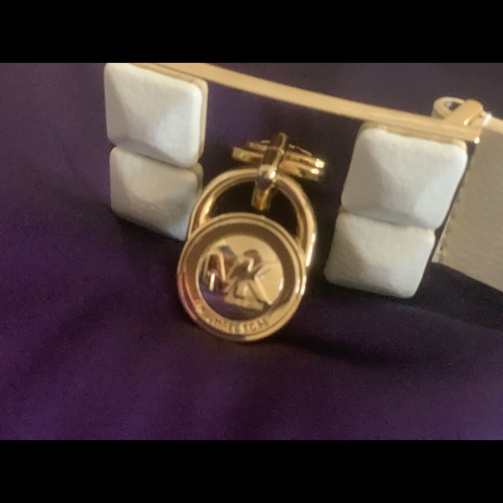 MK Cream belt/buckle accented with a gold MK lock